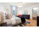 Well-lit primary bedroom featuring wood floors, large bed, and ample natural light from the window at 469 Tripp Dr, Golden, CO 80401