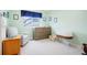 Bright Bedroom featuring a comfortable armchair, changing table, and a modern bassinet at 469 Tripp Dr, Golden, CO 80401