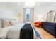 Well-lit primary bedroom featuring wood floors, large bed, and ample natural light from the window at 469 Tripp Dr, Golden, CO 80401