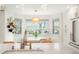 Bright dining area offers an abundance of natural light and a view of the exterior landscaped yard at 469 Tripp Dr, Golden, CO 80401