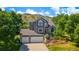Two-story home with mature trees, three-car garage, attractive curb appeal and mountain views at 469 Tripp Dr, Golden, CO 80401