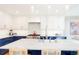 Bright kitchen features an island with barstool seating and modern appliances at 469 Tripp Dr, Golden, CO 80401