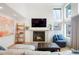 Cozy living room features a fireplace, large windows with natural light, and comfortable seating at 469 Tripp Dr, Golden, CO 80401