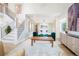 Open-concept living area with connecting dining room and staircase, boasting hardwood floors and light-filled space at 469 Tripp Dr, Golden, CO 80401