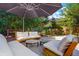 Outdoor patio provides ample seating and a relaxing atmosphere with lush greenery and stone accents at 469 Tripp Dr, Golden, CO 80401