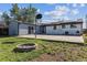 Spacious yard featuring patio, brick fire pit, and backyard with solar panels at 8641 Lowell Blvd, Westminster, CO 80031