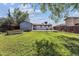 Expansive lawn with mature trees, patio, and outbuilding at 8641 Lowell Blvd, Westminster, CO 80031
