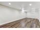 Finished basement area with recessed lighting and modern wood-look flooring at 8641 Lowell Blvd, Westminster, CO 80031