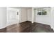 Spare bedroom with hardwood floors, baseboards, a closet, and a large window overlooking the backyard at 8641 Lowell Blvd, Westminster, CO 80031