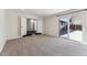 Carpeted bedroom with large closet and glass sliding doors accessing a patio area at 8641 Lowell Blvd, Westminster, CO 80031