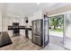 Updated kitchen with stainless steel appliances and granite countertops that leads to the backyard at 8641 Lowell Blvd, Westminster, CO 80031