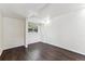 Spare bedroom with hardwood floors and a large window overlooking the backyard at 8641 Lowell Blvd, Westminster, CO 80031