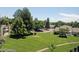 Lush green backyard and neighborhood view from a higher angle, enhancing the home's appeal at 14152 E Linvale Pl # 311, Aurora, CO 80014