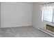 Bright bedroom featuring plush carpeting, a window with blinds, and a large closet at 14152 E Linvale Pl # 311, Aurora, CO 80014