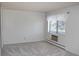 Cozy bedroom featuring plush carpeting, a window with blinds, and ample natural light at 14152 E Linvale Pl # 311, Aurora, CO 80014