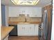 Kitchen featuring white cabinetry, stainless steel appliances, and eat-in breakfast bar at 14152 E Linvale Pl # 311, Aurora, CO 80014