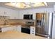 Updated kitchen features stainless steel appliances, white cabinets, and a ceiling fan at 14152 E Linvale Pl # 311, Aurora, CO 80014