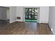 Spacious living room with wood-look floors and access to the balcony at 14152 E Linvale Pl # 311, Aurora, CO 80014