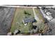 An aerial view of the home set on a large lot, featuring a mature tree landscape and outdoor space at 1062 Pinon Ln, Elizabeth, CO 80107