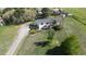 Aerial view of a home with a long driveway and lots of potential for parking and outdoor activities at 1062 Pinon Ln, Elizabeth, CO 80107