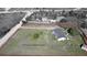 An aerial view showing the expansive lot and charming home with a long driveway, surrounded by mature trees and open space at 1062 Pinon Ln, Elizabeth, CO 80107