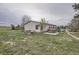 Backyard featuring a hot tub, small deck, and a garden, blending leisure and greenery at 1062 Pinon Ln, Elizabeth, CO 80107