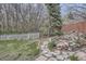Landscaped backyard area with stacked rocks and mature landscaping at 1062 Pinon Ln, Elizabeth, CO 80107