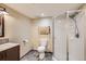 Bathroom featuring tile floors, shower and vanity with dark wood cabinets and granite countertop at 1062 Pinon Ln, Elizabeth, CO 80107