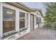 Home exterior featuring wooden deck and door with flower boxes and natural light at 1062 Pinon Ln, Elizabeth, CO 80107