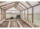 Spacious greenhouse with clear panels and wooden frame, ready for gardening at 1062 Pinon Ln, Elizabeth, CO 80107