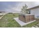 Outdoor hot tub on concrete patio with views of the yard and surrounding landscape at 1062 Pinon Ln, Elizabeth, CO 80107