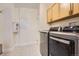 Well-equipped laundry room featuring modern LG washer and dryer units and plenty of storage space at 1062 Pinon Ln, Elizabeth, CO 80107