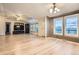Spacious living room boasting hardwood floors, and large windows providing an abundance of light at 1062 Pinon Ln, Elizabeth, CO 80107