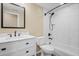 Modern bathroom featuring a marble vanity, sleek fixtures, and a tiled shower and tub combination at 23580 E Portland Way, Aurora, CO 80016