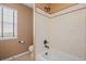 Cozy bathroom featuring a well-maintained tub-shower, toilet and window, ideal for a quick refresh at 23580 E Portland Way, Aurora, CO 80016