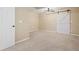 Empty bedroom with a modern ceiling fan and a sliding barn door at 23580 E Portland Way, Aurora, CO 80016
