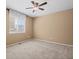 This bedroom features a ceiling fan and a window providing natural light at 23580 E Portland Way, Aurora, CO 80016