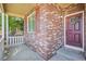 A charming brick front porch with decorative details and a welcoming entrance at 23580 E Portland Way, Aurora, CO 80016