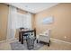 Inviting home office featuring a desk, accent chair, and ample natural light at 23580 E Portland Way, Aurora, CO 80016