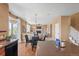 Open-concept kitchen with hardwood floors leading to the dining area and living space, fostering connectivity at 23580 E Portland Way, Aurora, CO 80016
