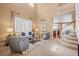 Elegant living room with soaring ceilings, large windows, and comfortable seating at 23580 E Portland Way, Aurora, CO 80016