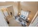 View of the living room from the second floor overlooking the large open space and natural light at 23580 E Portland Way, Aurora, CO 80016