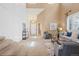 Elegant living room with soaring ceilings, comfortable seating, and an open floor plan at 23580 E Portland Way, Aurora, CO 80016