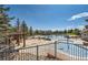 Community pool area featuring splash pad, a pool, and a covered picnic area at 23580 E Portland Way, Aurora, CO 80016
