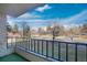 Enjoy beautiful views from the balcony with black metal railings and outdoor carpeting at 13992 E Marina Dr # 109, Aurora, CO 80014