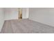 Carpeted bedroom shows an ensuite bath with a modern vanity and large closet at 13992 E Marina Dr # 109, Aurora, CO 80014