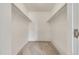 Walk-in closet features carpeting and ample storage space with hanging racks at 13992 E Marina Dr # 109, Aurora, CO 80014
