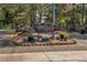 Attractive entrance sign 'Seville' amidst landscaped greenery, enhancing community charm and curb appeal at 13992 E Marina Dr # 109, Aurora, CO 80014