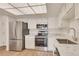 Bright kitchen boasts stainless steel appliances and granite countertops for a modern touch at 13992 E Marina Dr # 109, Aurora, CO 80014