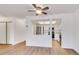 Open living area with wood-look floors and views into the updated kitchen at 13992 E Marina Dr # 109, Aurora, CO 80014